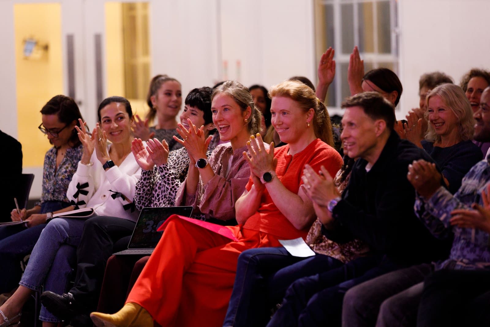 Audience applauding at a keynote